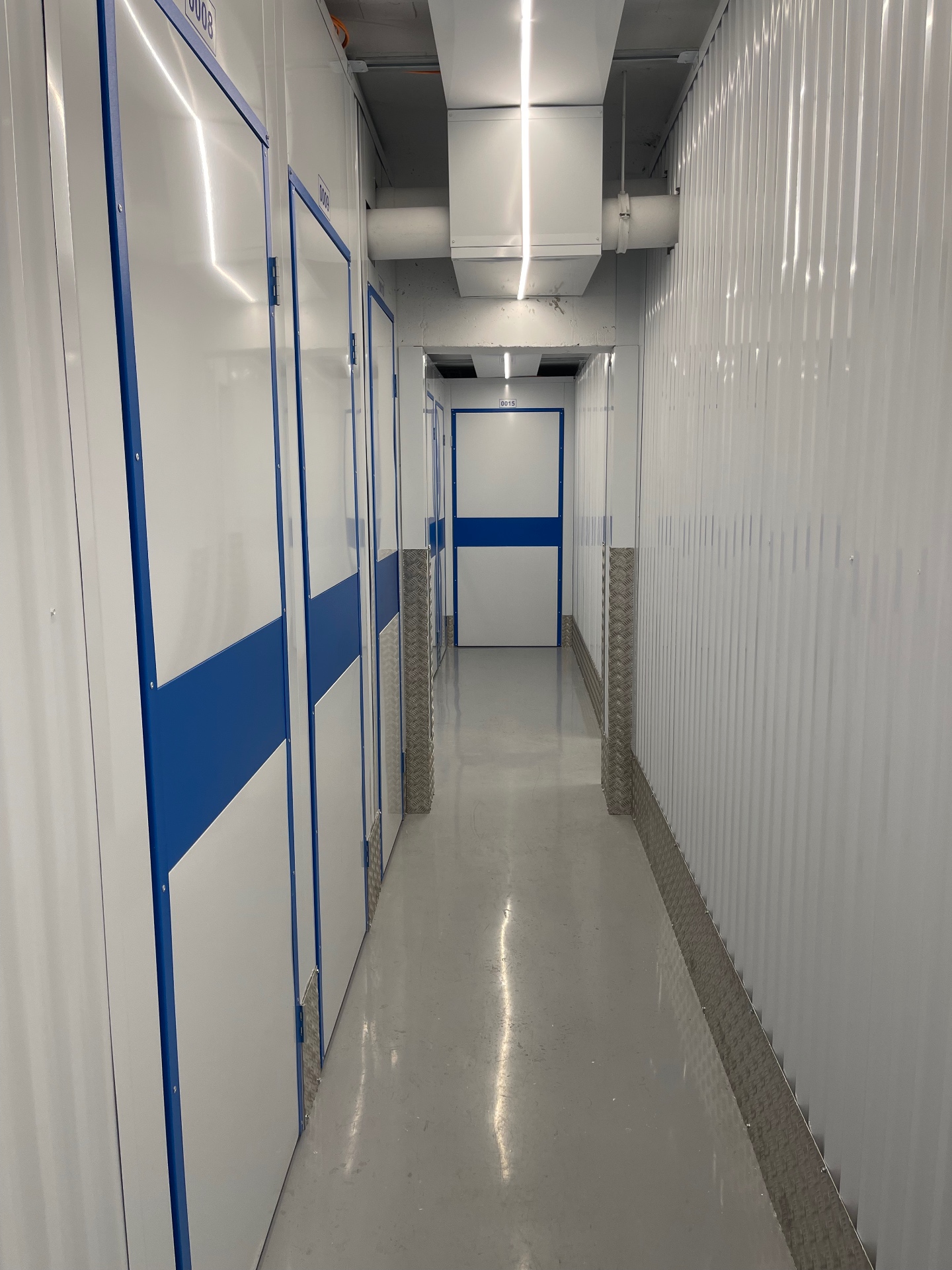 Modern self-storage cellar corridor with LED lighting